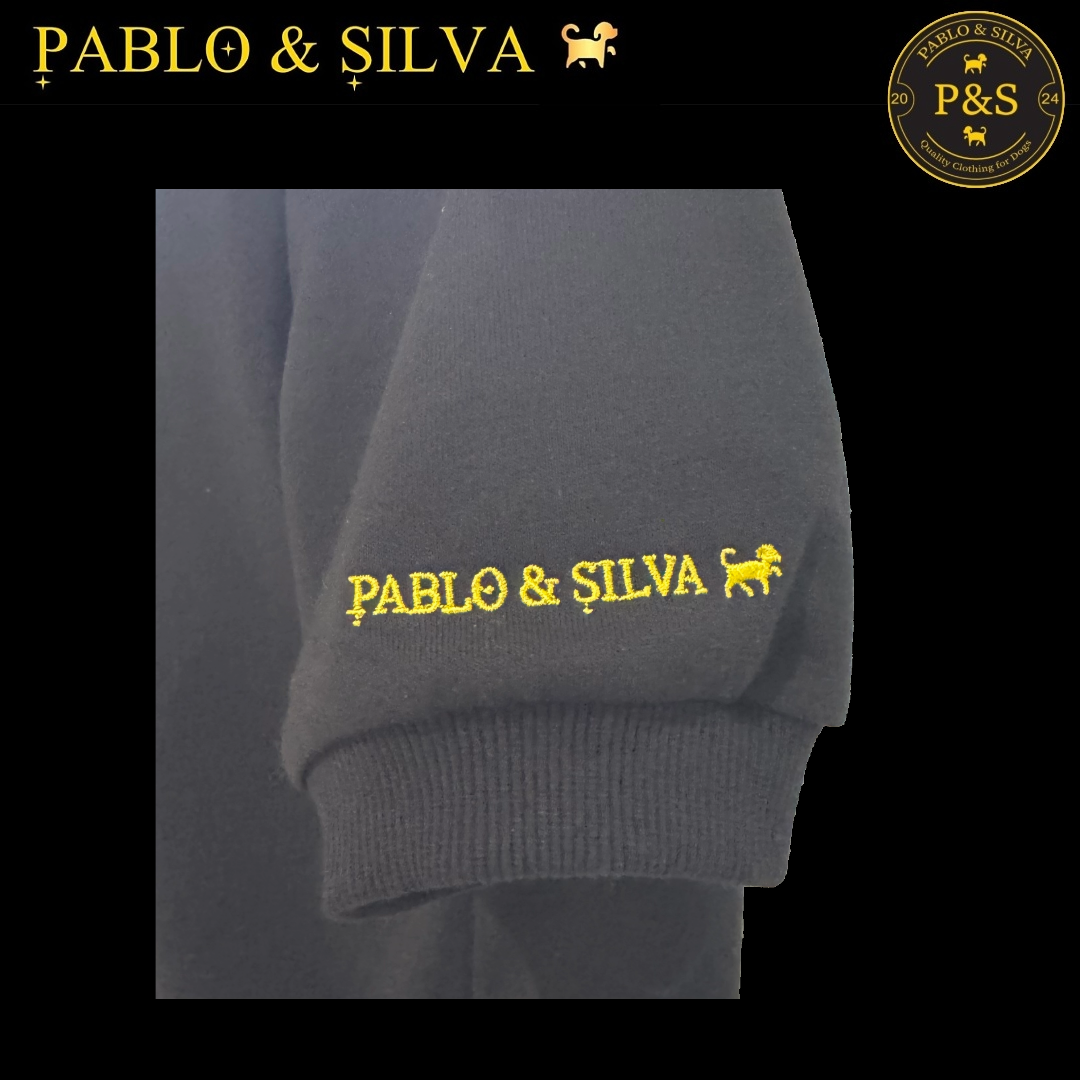 The black hoodie with gold 'Pablo & Silva' logo embroidered on the sleeve