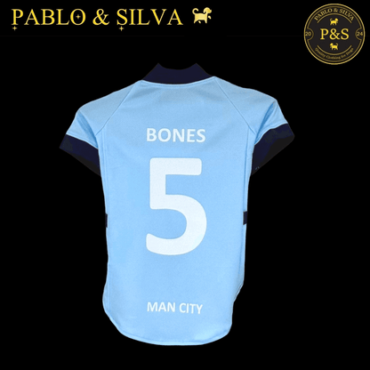 Man City shirt with 'BONES' and number '5', branded 'Pablo & Silva' on a black background.