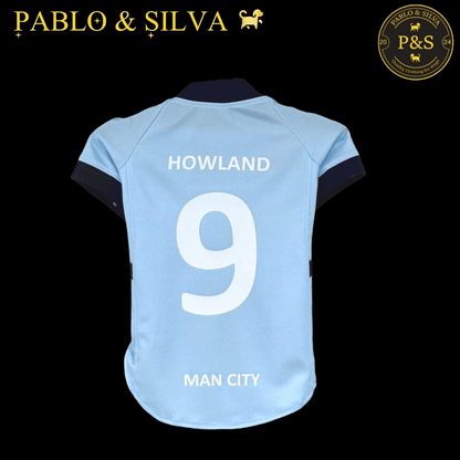 Man City shirt with 'HOWLAND 9' and 'MAN CITY' text, on a black background with 'Pablo & Silva' branding.